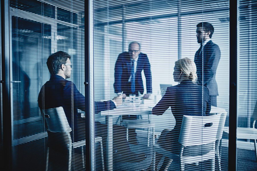 Boardroom meeting about legal document translation