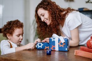 woman with son celebrating hanukkah